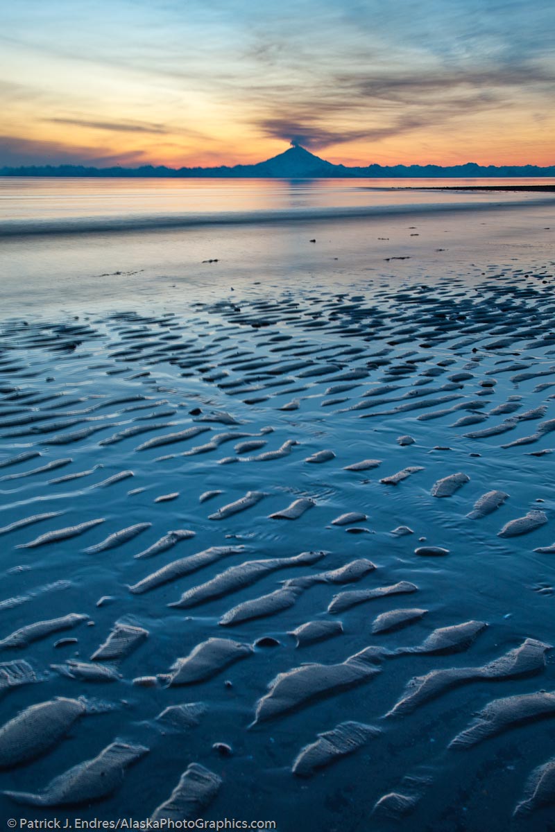 Plume of gas and vapor vent from the summit of Mt. Redoubt volcano (10,191 ft), of the Chigmik mountains, Aleutian range. View across Cook Inlet approximately 50 miles, at sunset, southcentral, Alaska.