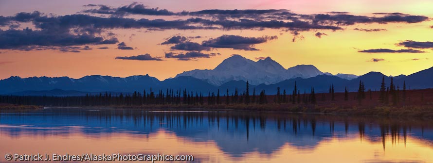View of the north and south summits of Mt McKinely, locally called "Denali", North America's tallest mountain, 20,320 ft., from a small pond along the George Parks highway. Canon 1Ds Mark III, 70-200mm (145mm), .08/sec @ f/10, ISO 100