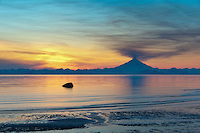 Plume of gas and vapor vent from the summit of Mt. Redoubt volcano (10,191 ft), of the Chigmit mountains, Aleutian range. View across Cook Inlet approximately 50 miles, at sunset, southcentral, Alaska.