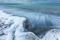 Waves splash along the shore of Barter Island on the Beaufort sea at freeze up.
