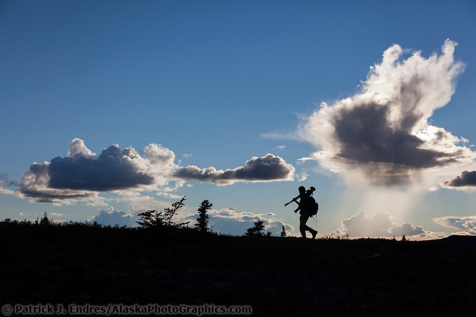 2126495.cr2 Photographer silhouetted against the sky in Denali National Park. (Patrick J. Endres / AlaskaPhotoGraphics.com)