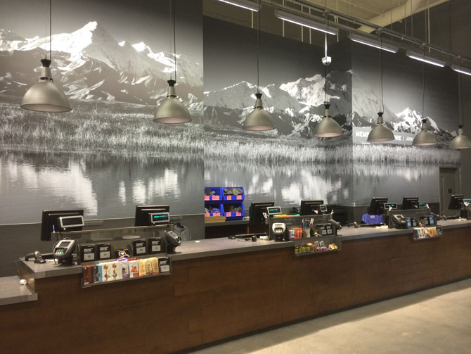 Wall mural installation at the Fairbanks REI store.