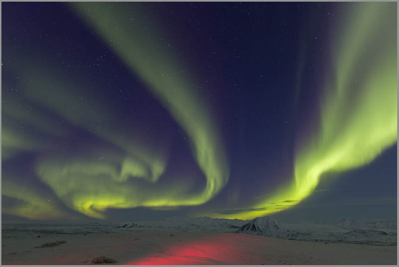 This is the original photo, which shows the foreground lit by a red headlamp.