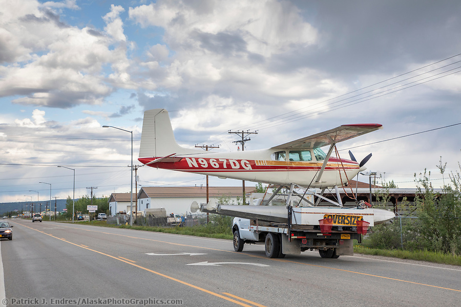 Bush plane on floats is transported through the streets of Fairbanks on a flatbed truck, Fairbanks, Alaska. (© Patrick J Endres / www.AlaskaPhotoGraphics.com)